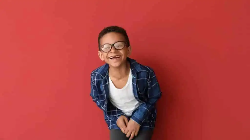 kid laughing with red background