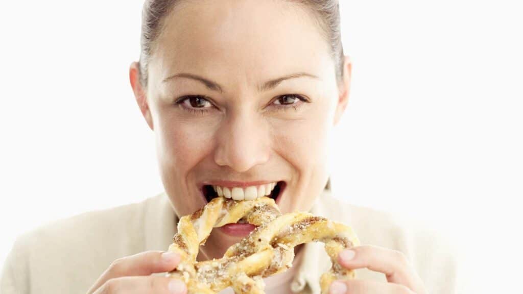 woman eating pretzel