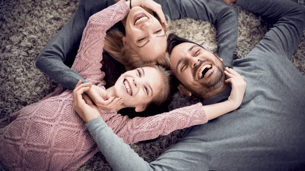 family laughing mom dad girls happy family