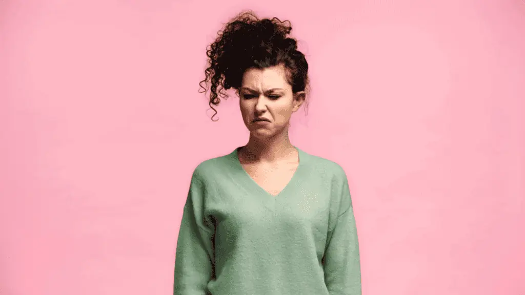 woman disgusted mad messy bun