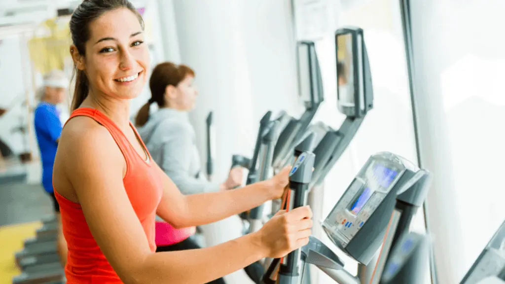 woman at the gym elliptical work out