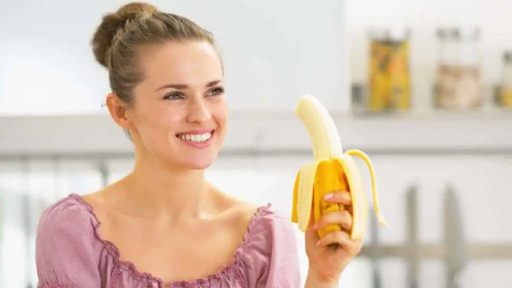woman eating a banana
