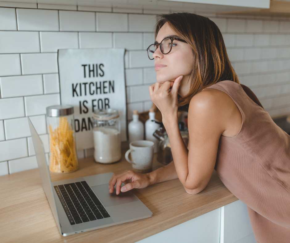 woman on computer in her kitchen