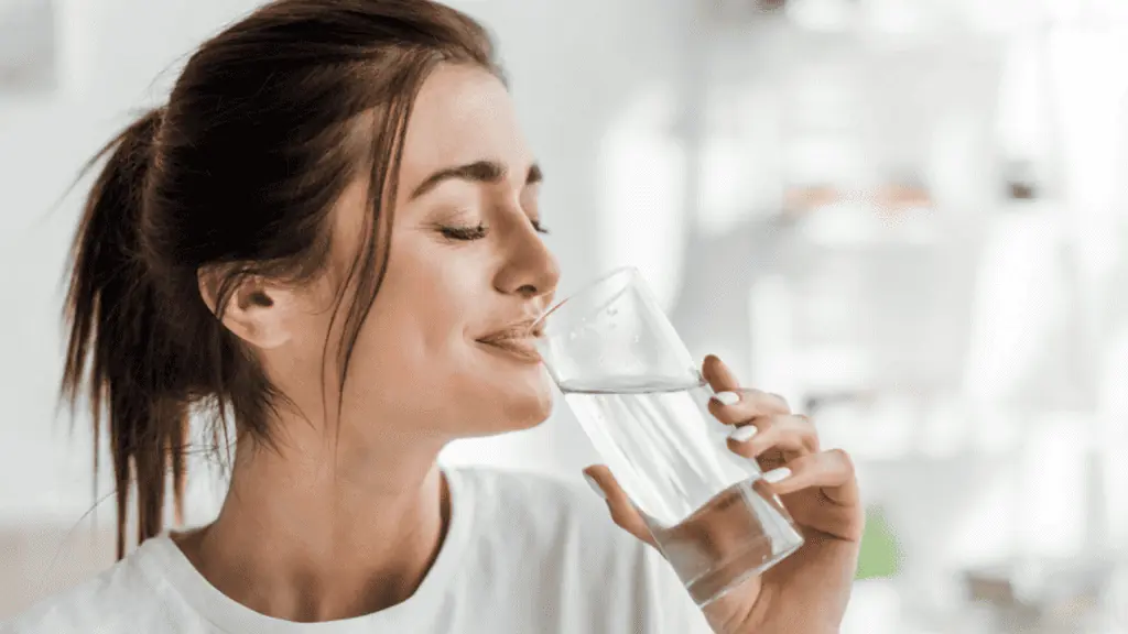woman drinking water healthy