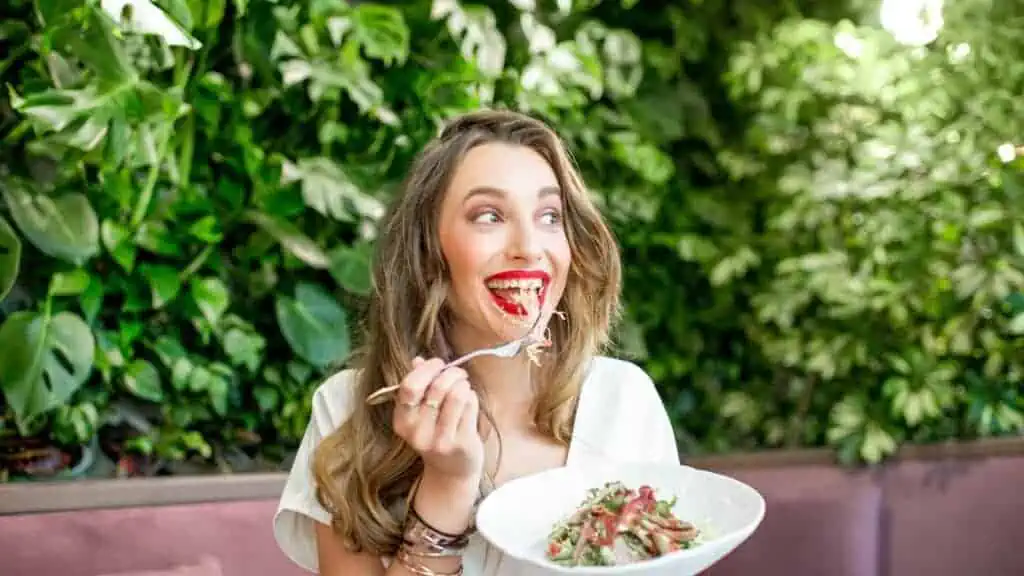 woman eating salad