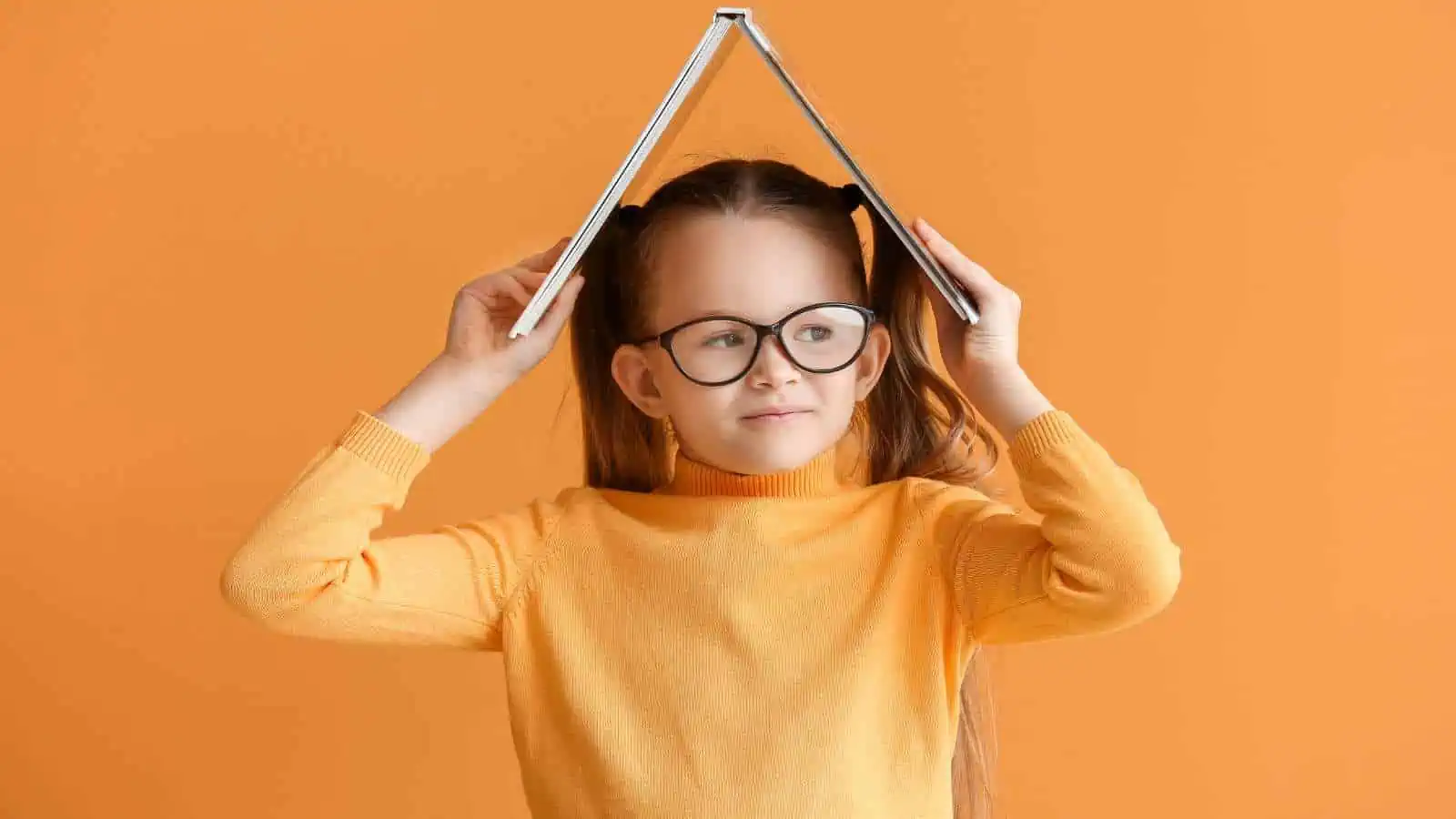 girl reading a book orange