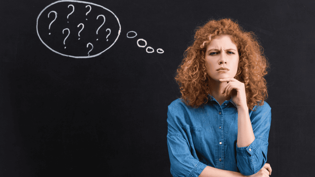 woman thinking confused question marks