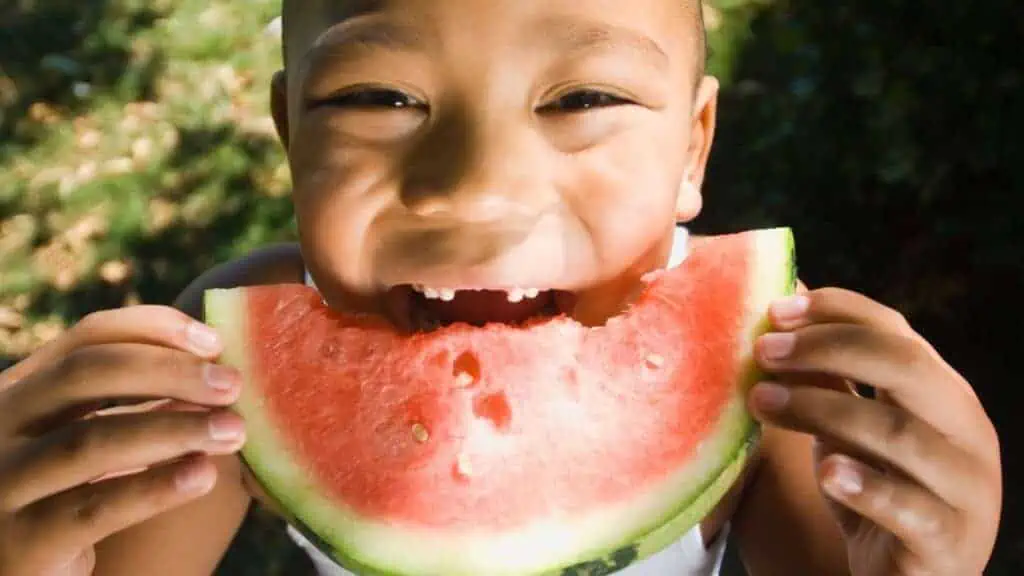 kid eating watermelon, healthy eating for kids is possible