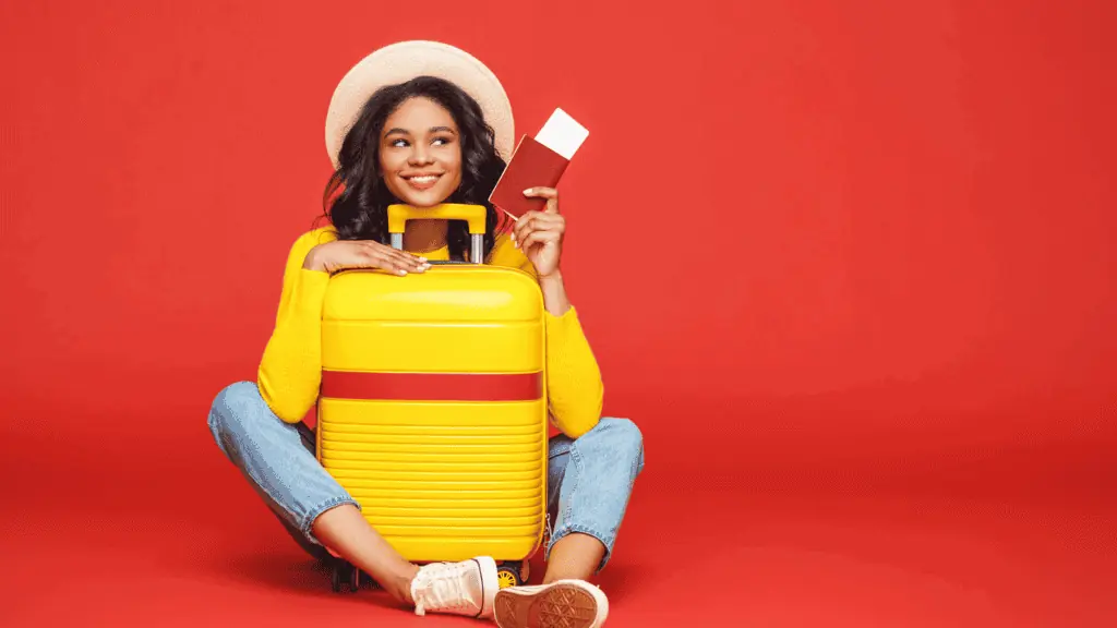 woman traveling suitcase passport happy