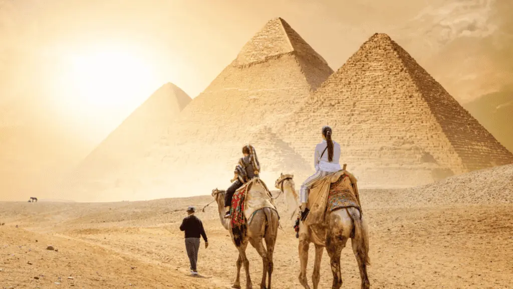 Egypt pyramids camel tourist travel