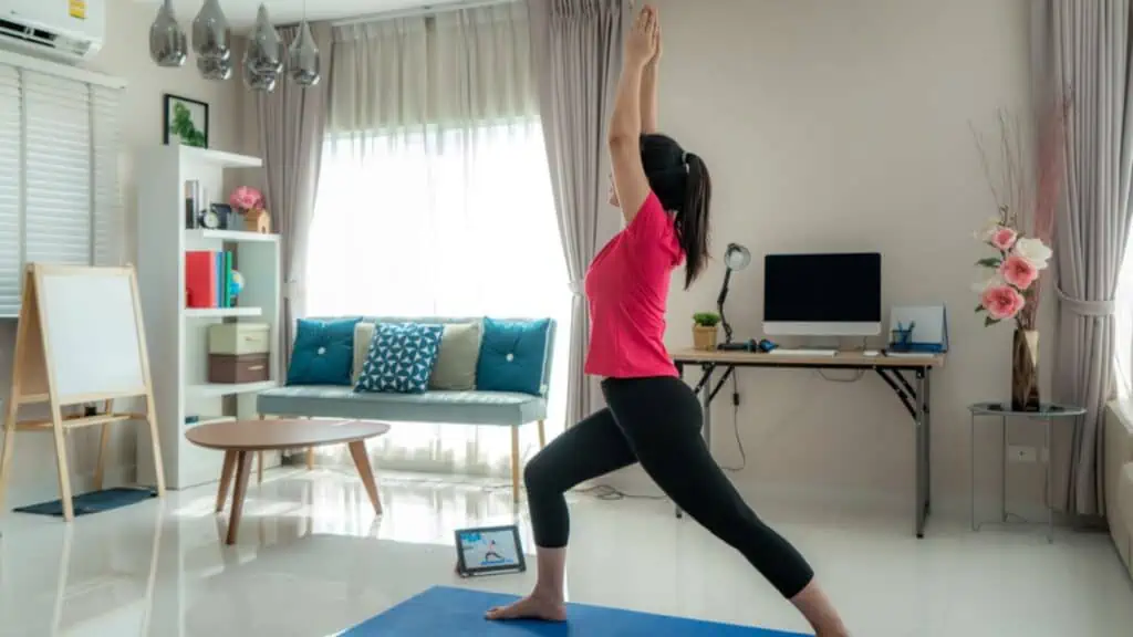 Asian woman making yoga exercise for step away from their computers Woman doing lunges