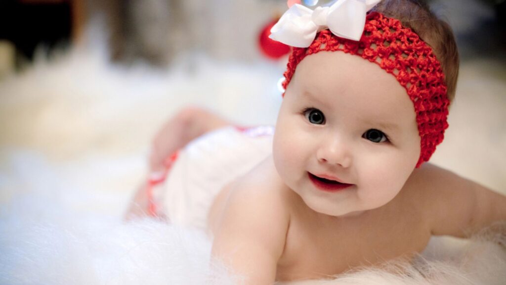 Baby girl wearing red headband