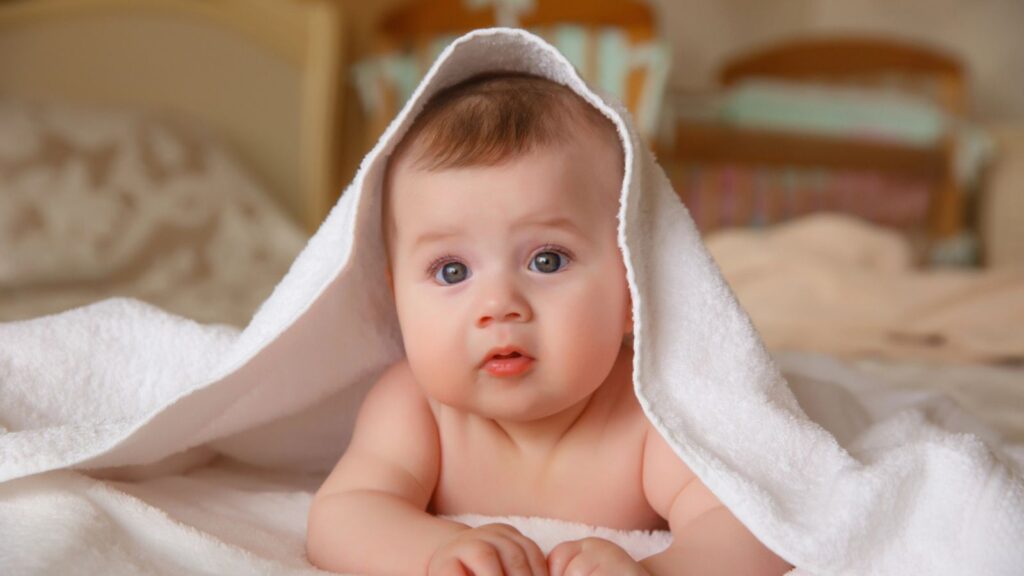 Baby girl with white blanket