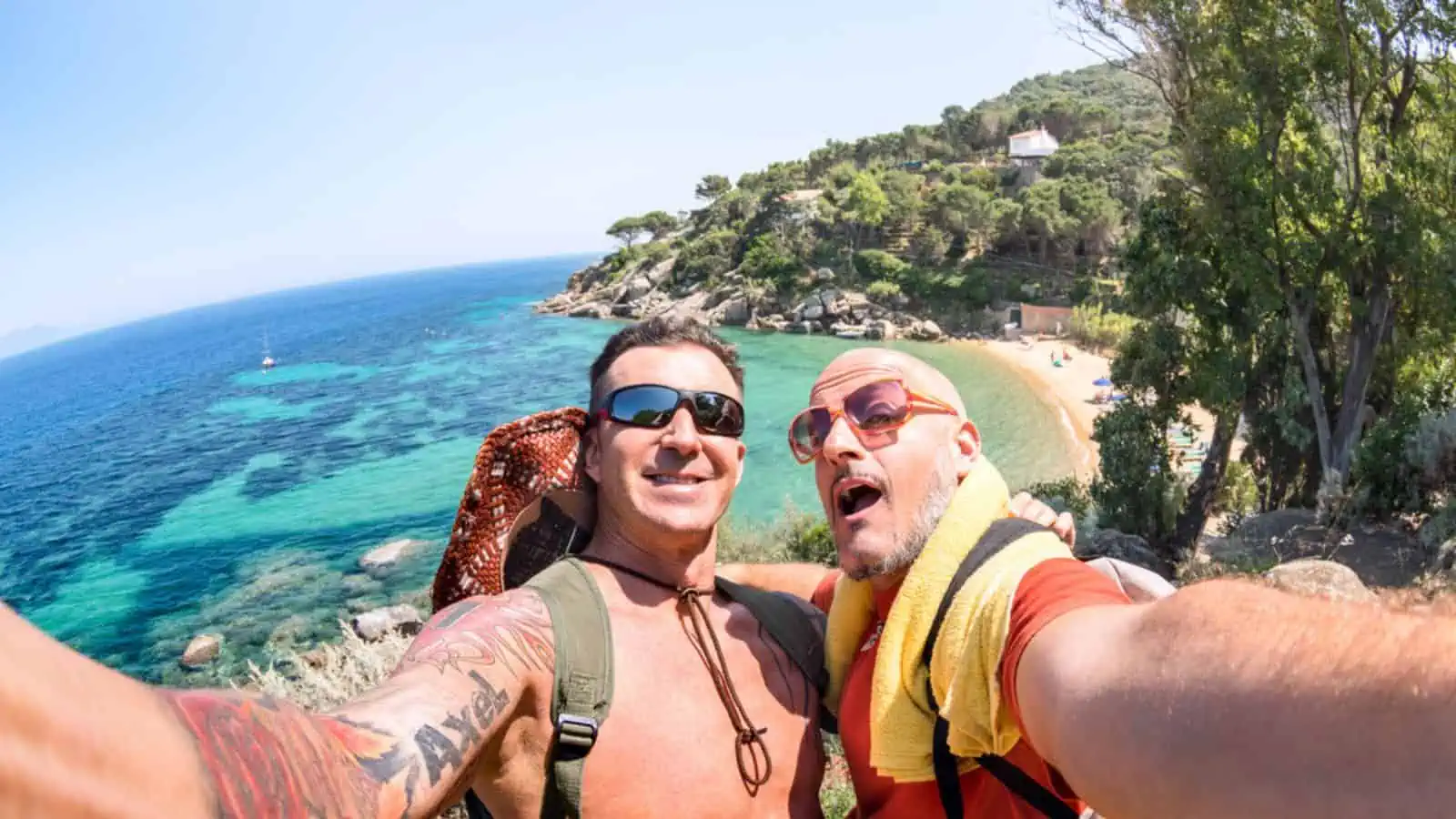 Best friends taking selfie at Giglio Island on adventure travel