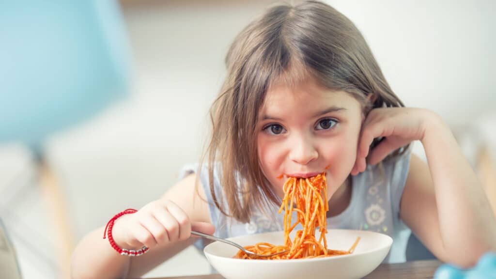 girl eating noodles