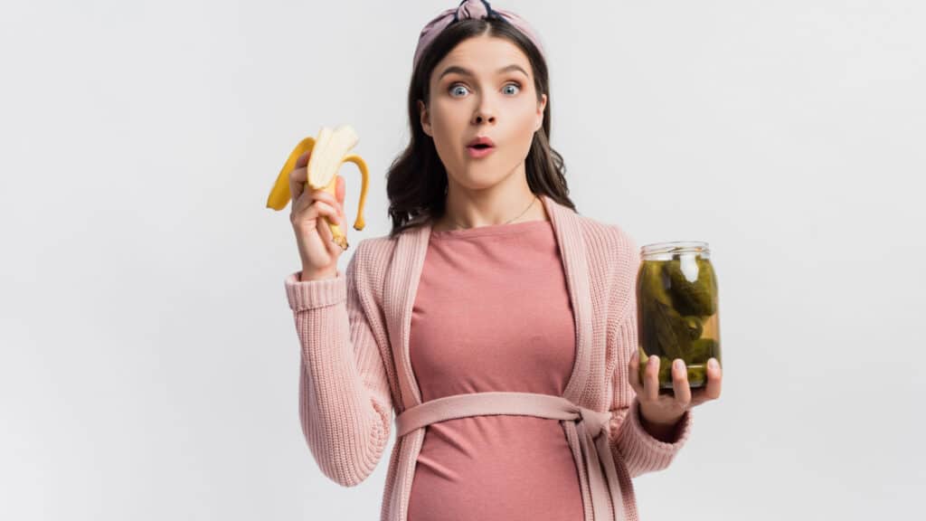 pregnant woman eating pickles