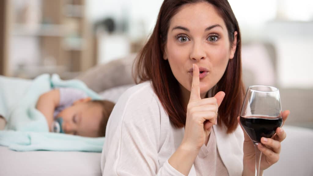 mom drinking wine during nap