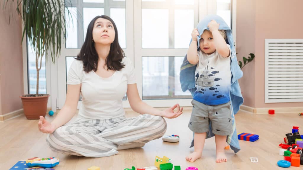 woman meditating with son