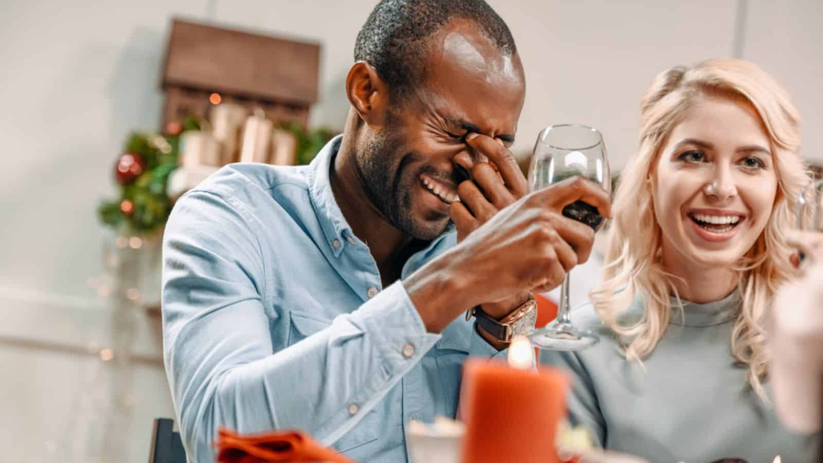 Couple laughing at the dinner table