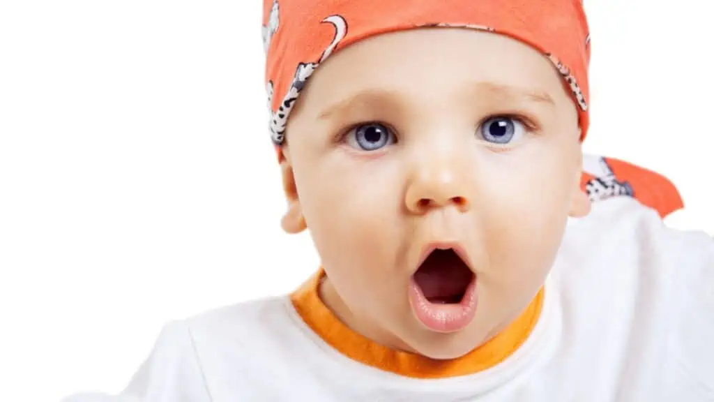 Cute shocked baby on white