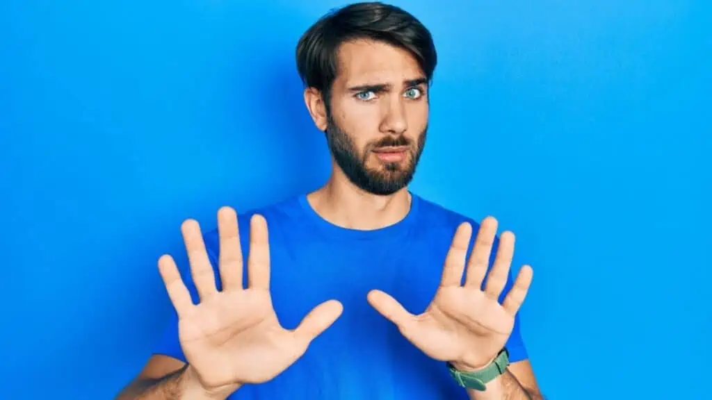 Disgusted man wearing blue shirt