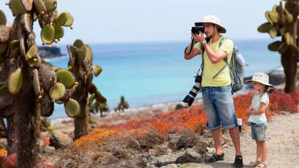 Father and daughter at scenic terrain on Galapagos Island