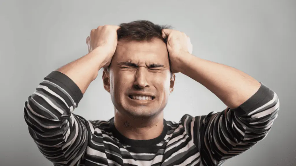 Frustrated man wearing stripes