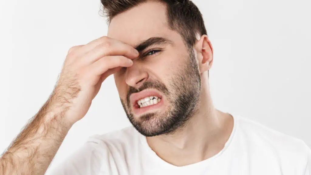 Frustrated man wearing white shirt