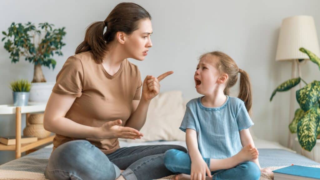 Frustrated mother is scolding her child