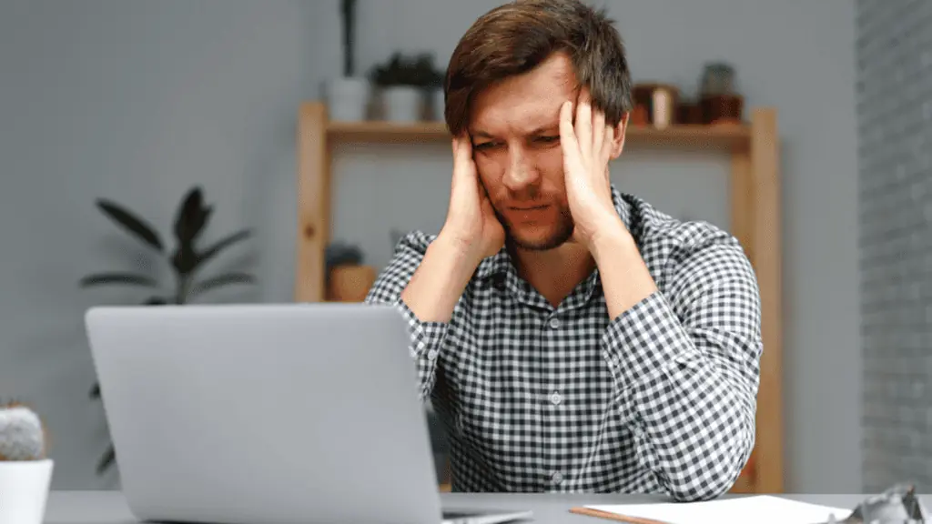 Frustrated working man on his laptop