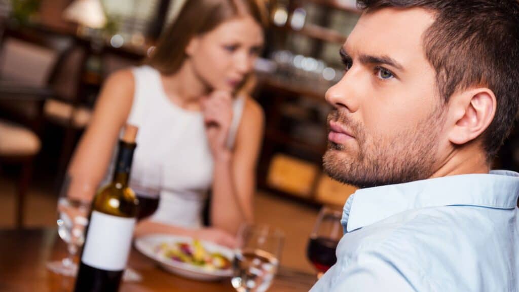 Frustrated young man in a restaurant