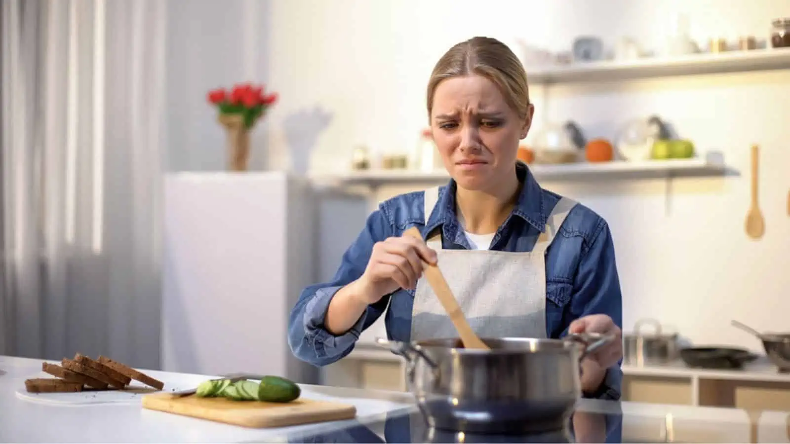 Woman disgusted with stinky meal on stove