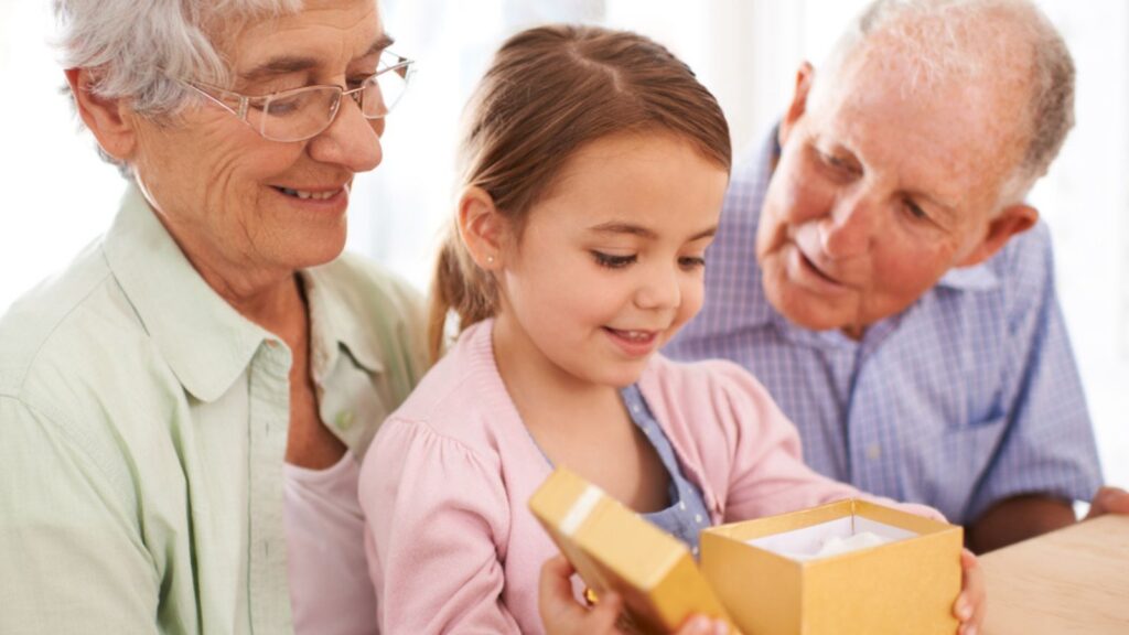 Grandparents will always spoil you. a senior couple giving a gift to their granddaughter