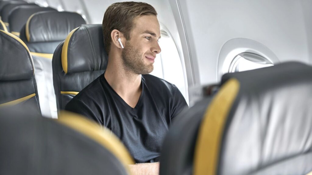 Handsome man in airplane