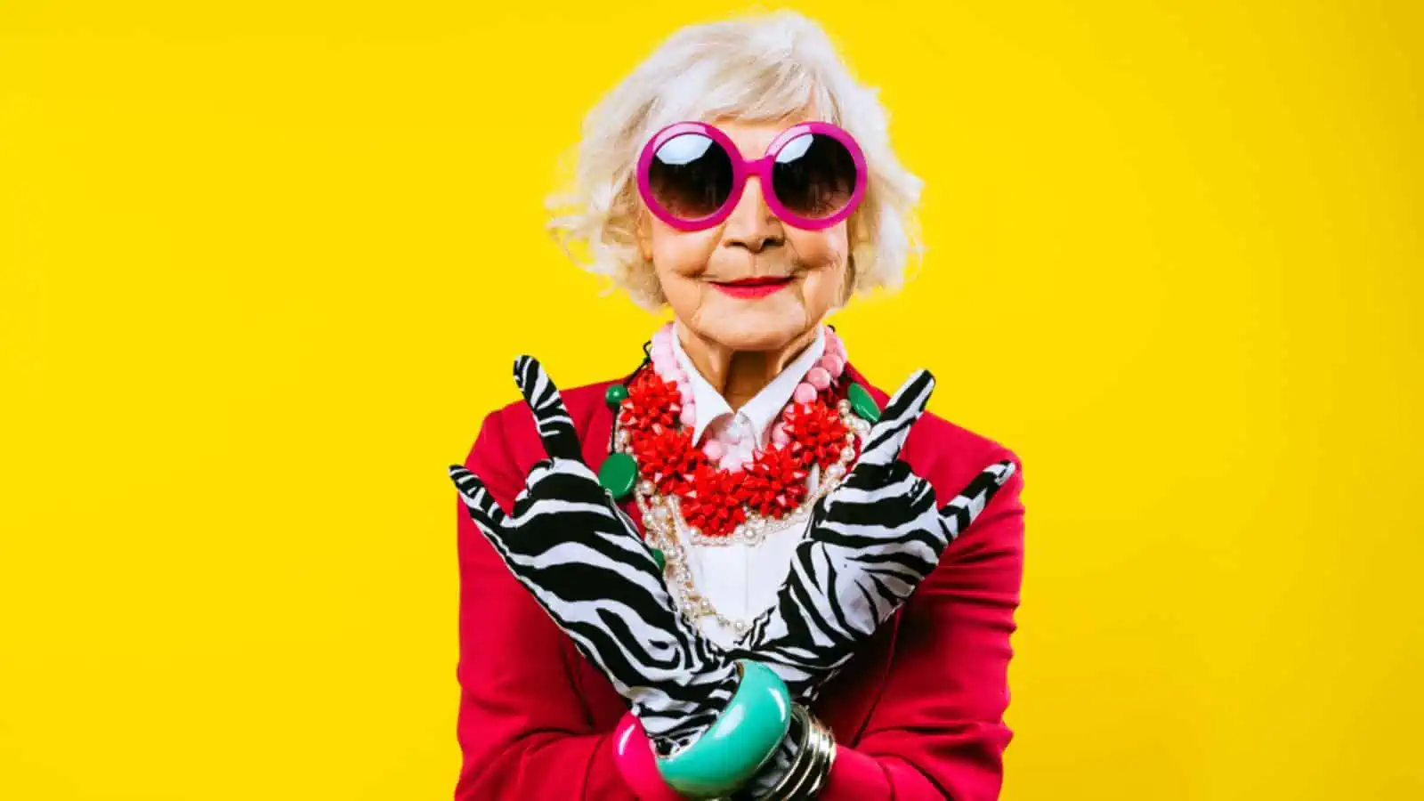 Happy and funny cool old lady with fashionable clothes