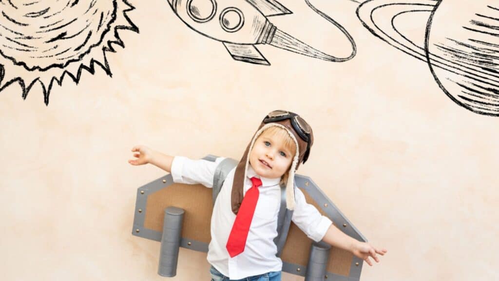 Happy child pretend to be astronaut