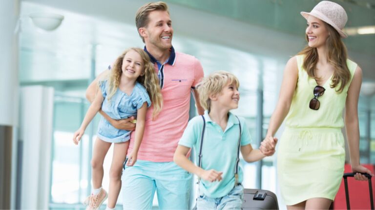 Happy family at the airport for travel