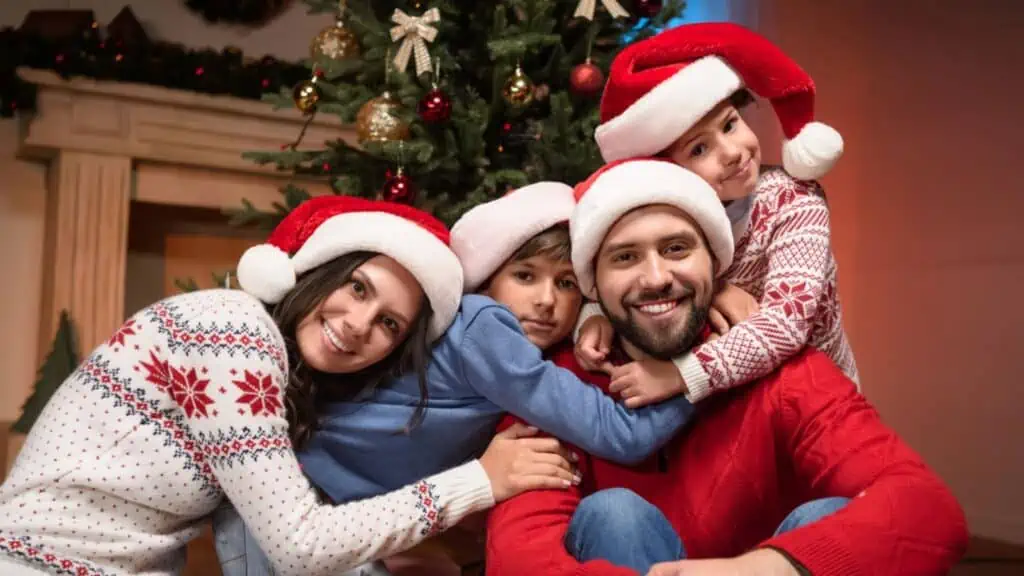 Happy family in santa hats
