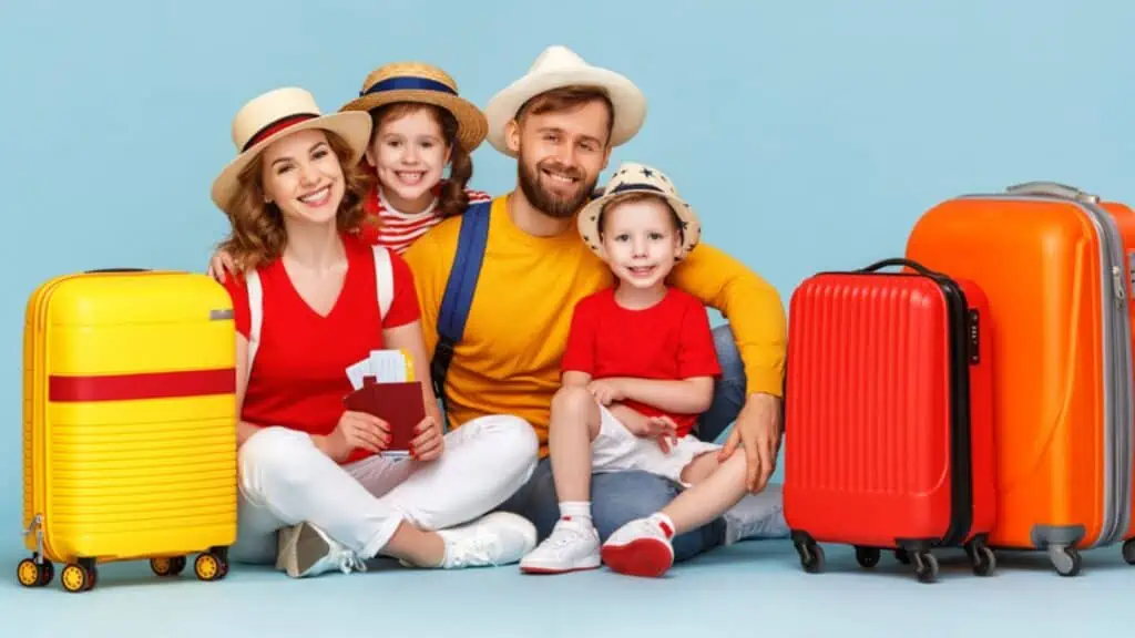 Happy family ready to travel with luggage