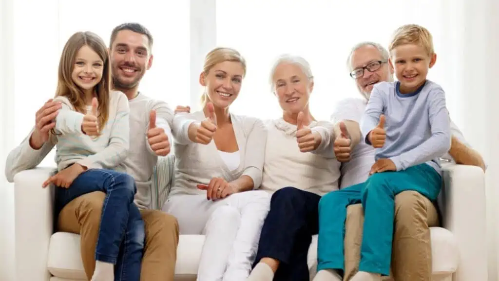 Happy family sitting on couch at home