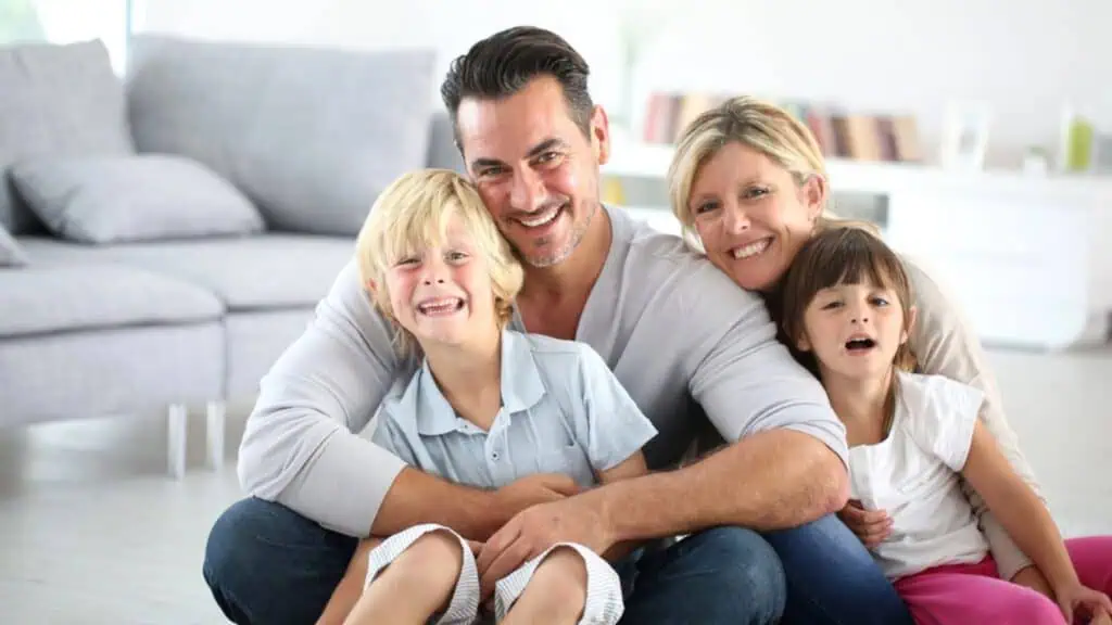Happy family sitting on floor