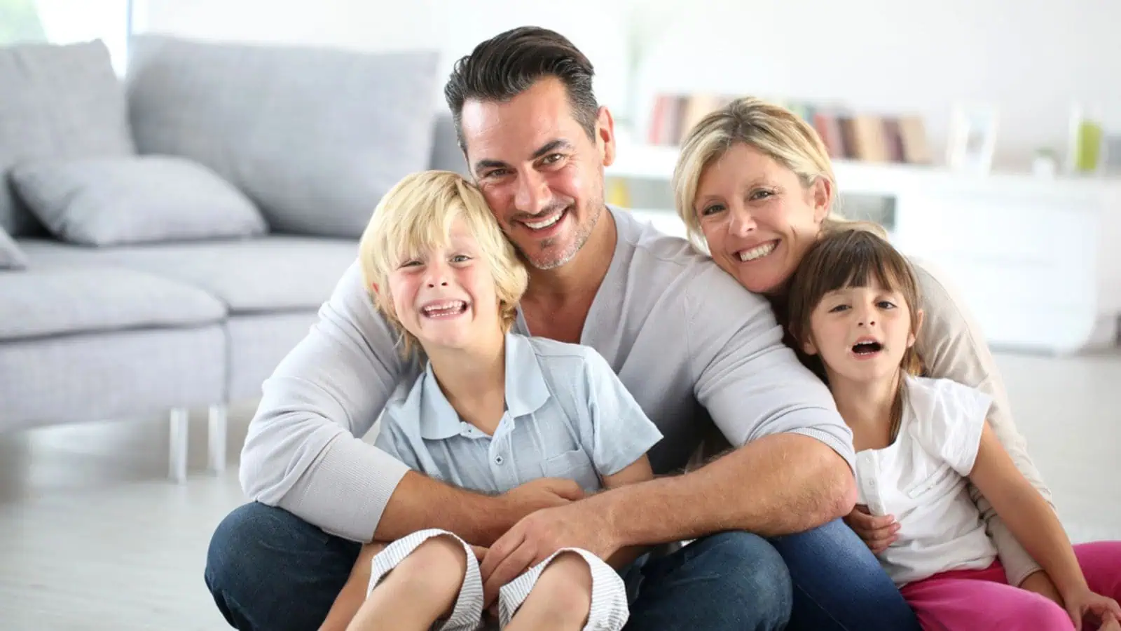 Happy family sitting on floor
