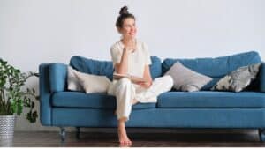 Happy thinking woman writes down her plan in a diary for a day
