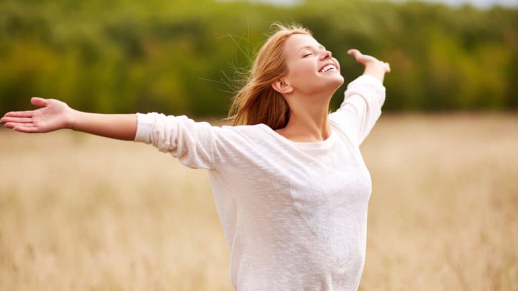 Happy young female enjoying freedom