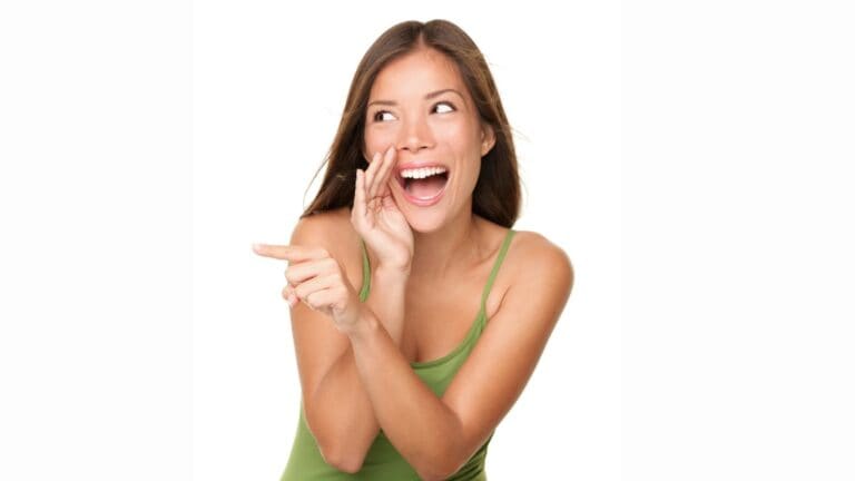Laughing and pointing woman on white