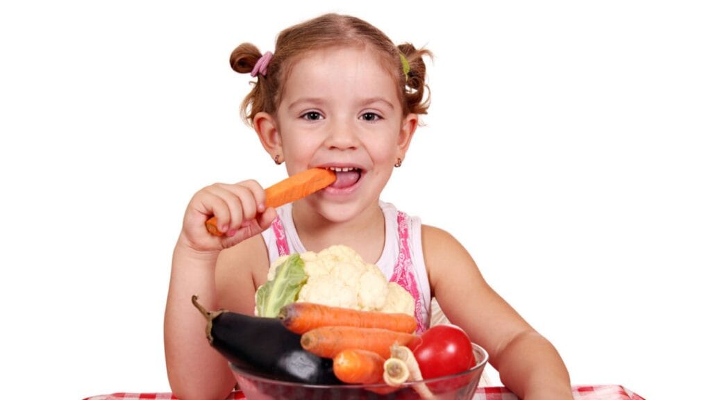 Little girl eat carrot