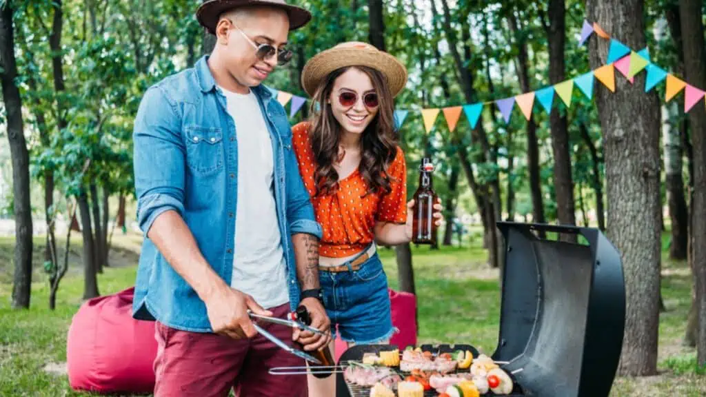 Man and woman cooking bbq