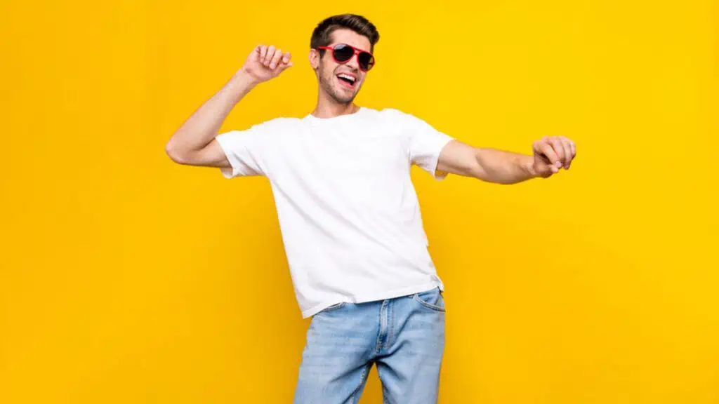 Man dance wear glasses t-shirt on yellow