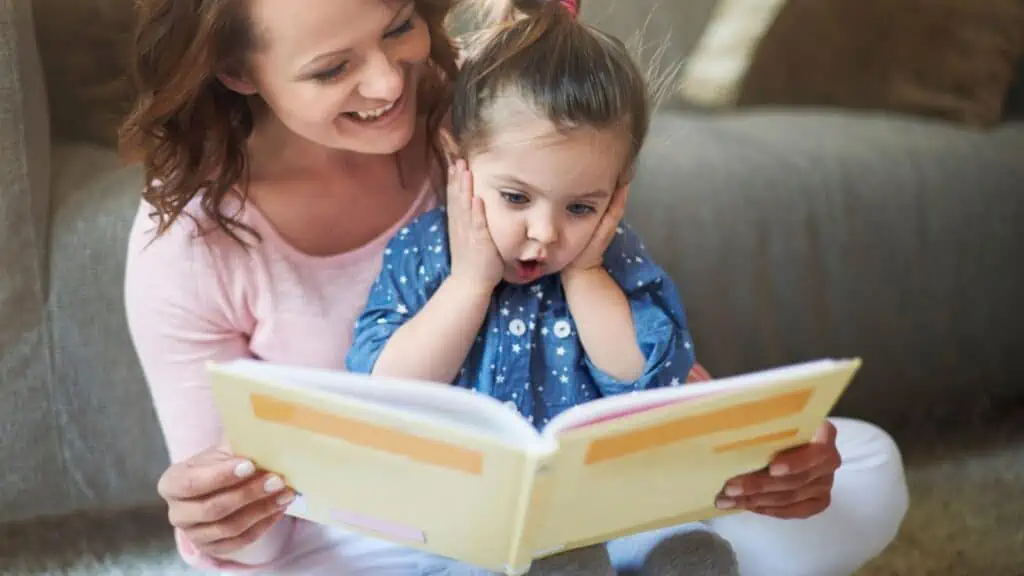 Mother and shocked daughter read book