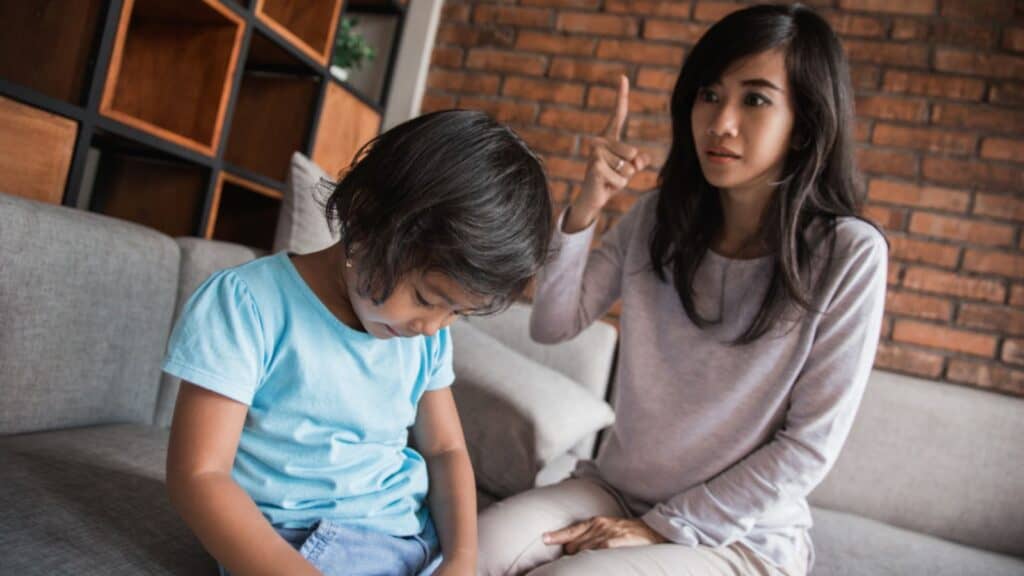Mother scolding her daughter for bad behavior